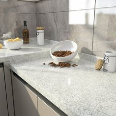 a counter top with bowls and cups on it