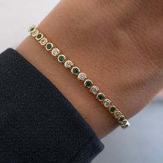 "Rounded bezel tennis bracelet featuring alternating emerald and cubic zirconia stones. Looks absolutely gorgeous and high-end! Handmade with love, care and attention to detail! - - - D E T A I L S - - - * Made of 925 Sterling Silver * THICK plating of 14k Gold or Rhodium  * 6.25\" and 6.75\" Bracelet Lengths * 3mm Thickness * Made of highest quality cubic zirconia  * VERY HIGH QUALITY * Nickel-free & Hypoallergenic - will not irritate skin! * Box Clasp Closure BRACELETS ON MODEL 🤍  https://www.etsy.com/listing/1615215846/tennis-bracelet-gold-bracelet-diamond?click_key=39e4b873348cd5527a8200b2bf850b35e8df6cdc%3A1615215846&click_sum=07685760&ref=shop_home_active_35&pro=1&frs=1 🤍 https://www.etsy.com/listing/1388355106/tennis-bracelet-gold-tennis-bracelet?click_key=e8f03881458e404bac08be4a Love Bracelet And Tennis Bracelet, Luxury Green Women's Tennis Bracelet, Simple Tennis Bracelet, Unique Tennis Bracelets, Bezel Tennis Bracelet, Expensive Bracelets, Emerald Bracelets, Emerald Tennis Bracelet, Tennis Bracelet Gold