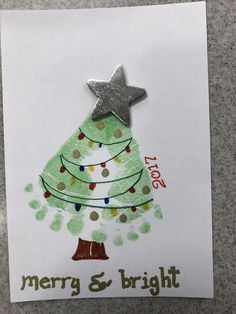 a handmade christmas card with a tree and star on the top that says merry & bright