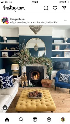 a living room filled with furniture and a fire place under a mirror on the wall