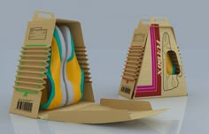 an open cardboard box with different colored shoes inside