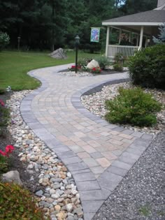 a brick walkway in front of a house