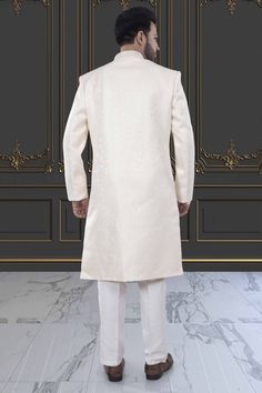 This Mens Sherwani is crafted in brocade, providing a luxurious and elegant touch. The intricate design and high-quality material make it perfect for special occasions and cultural events. Experience high-end fashion and traditional style with our Mens Sherwani - M42-S132. Mens Sherwani, Cultural Events, High End Fashion, Intricate Design, Traditional Style, Make It, High Quality, Design