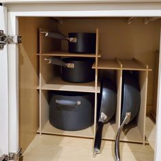 pots and pans are stored in the cupboard