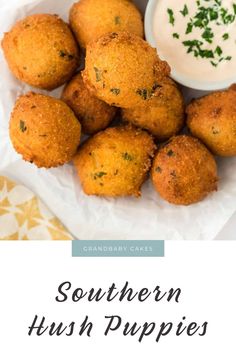 southern hush puppies on a plate with ranch dip and sour cream in the background