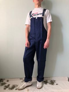 Vintage Work Dungarees Overalls / German Workwear / HEROMAThis vintage work overalls is in wonderful condition- name brand - HEROMA- made in Germany- color – navy blue- 3 front pockets- 2 side pockets- 1 back pocket- material - sanforized cotton- label size - 54 (watch measurements)FLAT Measurements:Waist : 20 inches (52cm) Inseam : 33 inches (84cm)Length : 43 1/2 inches (110cm)Hem trousers : 10 inches (25cm)Pay your attention to that  most antique items have been used and may have minor flaws.P Full Length Overalls With Pockets For Work, Cotton Overalls With Belt Loops For Work, Retro Style Straight Leg Cotton Overalls, Cotton Utility Overalls, Utility Cotton Overalls Pants, Utility Style Overalls With Belt Loops, Cotton Workwear Overalls, Full Length Cotton Overalls With Pockets, Utility Style Bib Front Bottoms For Workwear