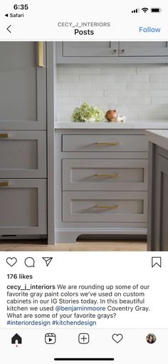 the kitchen cabinets are painted white and have gold handles