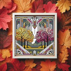 an art print with autumn leaves surrounding it and the image of two trees surrounded by fall colored leaves