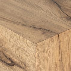 a close up view of the top of a wooden table with wood grains on it