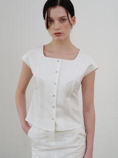 This is a comfortable and trendy top by ourcomos that is made out of high quality cotton and tencel blend fabric. With refined design detail with trendy look, it will stand out from your casual and feminine daily outfit.- Square neckline- Minimal and slim silhouette- Glossy buttons for cool and luxurious mood Elegant Cotton Top For Workwear, Fitted Cotton White Tops, Classic Cotton Tops For Daywear, Elegant Cotton Blouse For Day Out, Classic Everyday Spring Tops, Classic Summer Workwear Tops, Classic Cotton Summer Blouse, Fitted Summer Blouse For Everyday, Feminine Fitted Cotton Tops