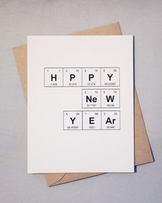 a card with the words happy new year written in scrabble type on it