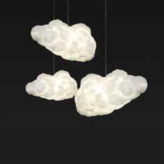 three white clouds hanging from the ceiling