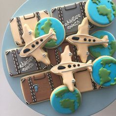 some cookies are shaped like airplanes and luggage