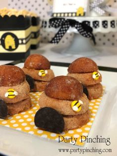 mini bee cookies are arranged on a plate