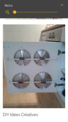 a white refrigerator freezer sitting on top of a wooden floor next to a stove