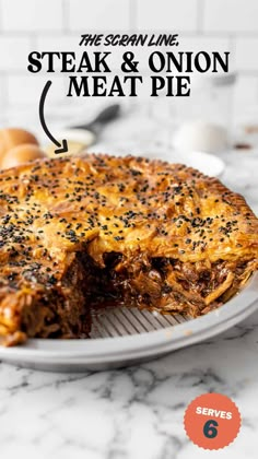 steak and onion meat pie on a white plate with the title overlaying it