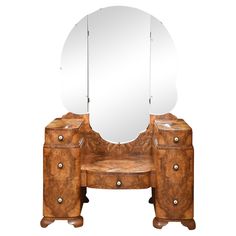 an antique vanity with mirror and stool