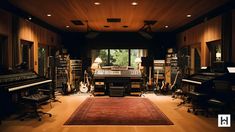 a recording studio with lots of equipment in it