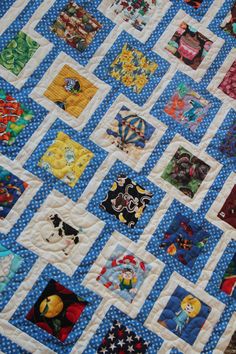 a blue and white quilt with many different pictures on it