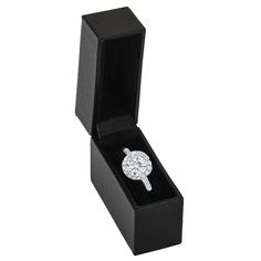 a diamond ring in a black box on a white background