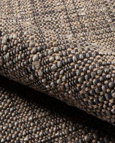 close up view of the texture of a tweed fabric