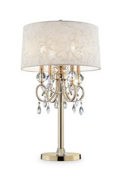 a table lamp with a white shade and crystal beads on the bottom half of it