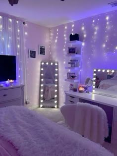 a bedroom with lights on the walls and a bed