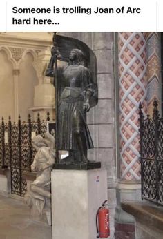 an image of a statue in the middle of a building that says joan of arc it's what she would have wanted