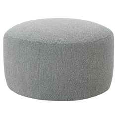 a large gray ottoman sitting on top of a white floor