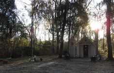 a small house in the middle of some trees