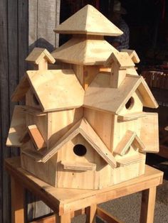 a bird house made out of wood with the words save from housesofotherbird info