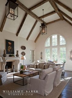 a living room filled with furniture and a fire place