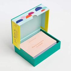 an open box with a note pad inside