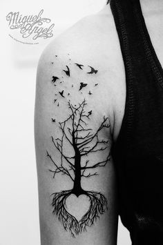 a woman with a tree tattoo on her arm