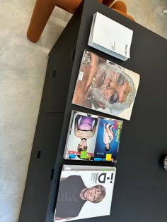 a black table with magazines on it