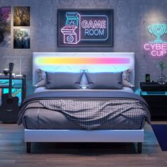 a bed room with a neatly made bed and neon signs