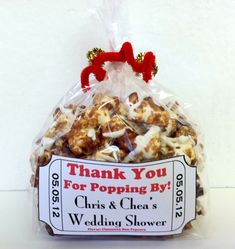 a bag filled with lots of popcorn sitting on top of a table