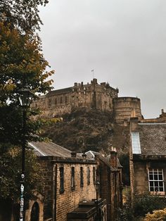 an old castle on top of a hill