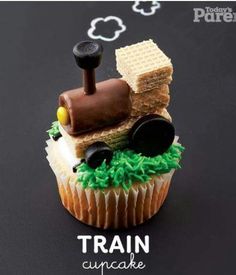 there is a cupcake made to look like a train on top of some waffles