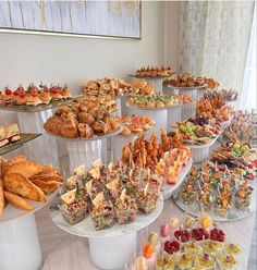 a table filled with lots of different types of food and desserts on it's sides