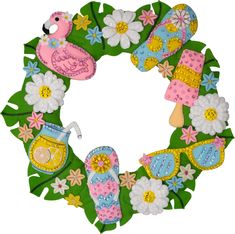 a wreath made out of green leaves with flowers and flip flops on the front