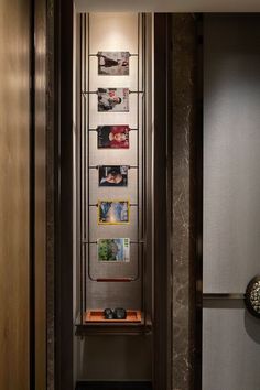 an elevator with pictures on the wall