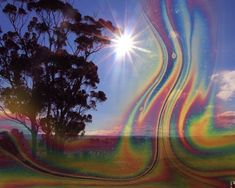 the sun shines brightly over an abstract landscape with trees and grass in the foreground