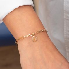 🌟 This 14k yellow gold paperclip chain bracelet is a timeless piece of faith jewelry, featuring a customizable mustard seed charm encased in laser enamel. Available in three sizes, this delicate bracelet symbolizes faith and hope, making it a perfect gift for birthdays, baptisms, and other special occasions. The bracelet's elegant design ensures it can be worn daily as a constant reminder of one's faith. 🔹 Key Details: Gold Karat: 14k solid gold Gold Color: Yellow Material: Genuine mustard see Yellow Gold Dainty Paperclip Bracelet Gift, Dainty Yellow Gold Paperclip Bracelet Gift, Yellow Gold Paperclip Chain Bracelet As Gift, Yellow Gold Paperclip Bracelet Gift, Tarnish Resistant Paperclip Bracelet As Gift, Tarnish Resistant Paperclip Bracelet For Gift, 14k Gold Paperclip Bracelet Gift, 14k Gold Paperclip Bracelet As Gift, Yellow Gold Charm Bracelet With Cable Chain For Gift