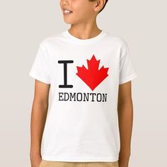 a young boy wearing a white t - shirt with the word edmonton printed on it