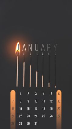 a wall calendar with candles on it and the word january spelled in white letters, against a black background