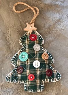 a plaid christmas tree ornament with buttons on it