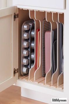 an organized kitchen drawer with various items in it