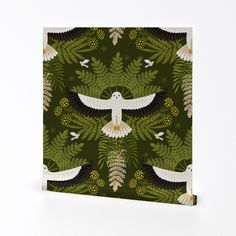 a green and white wallpaper with two birds flying over leaves, ferns and flowers