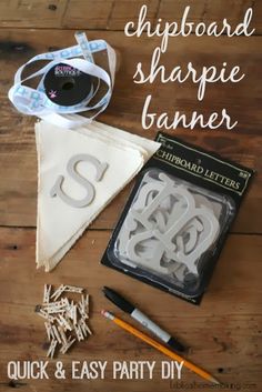 some crafting supplies are laying out on a wooden table with the words chipboard sharpie banner